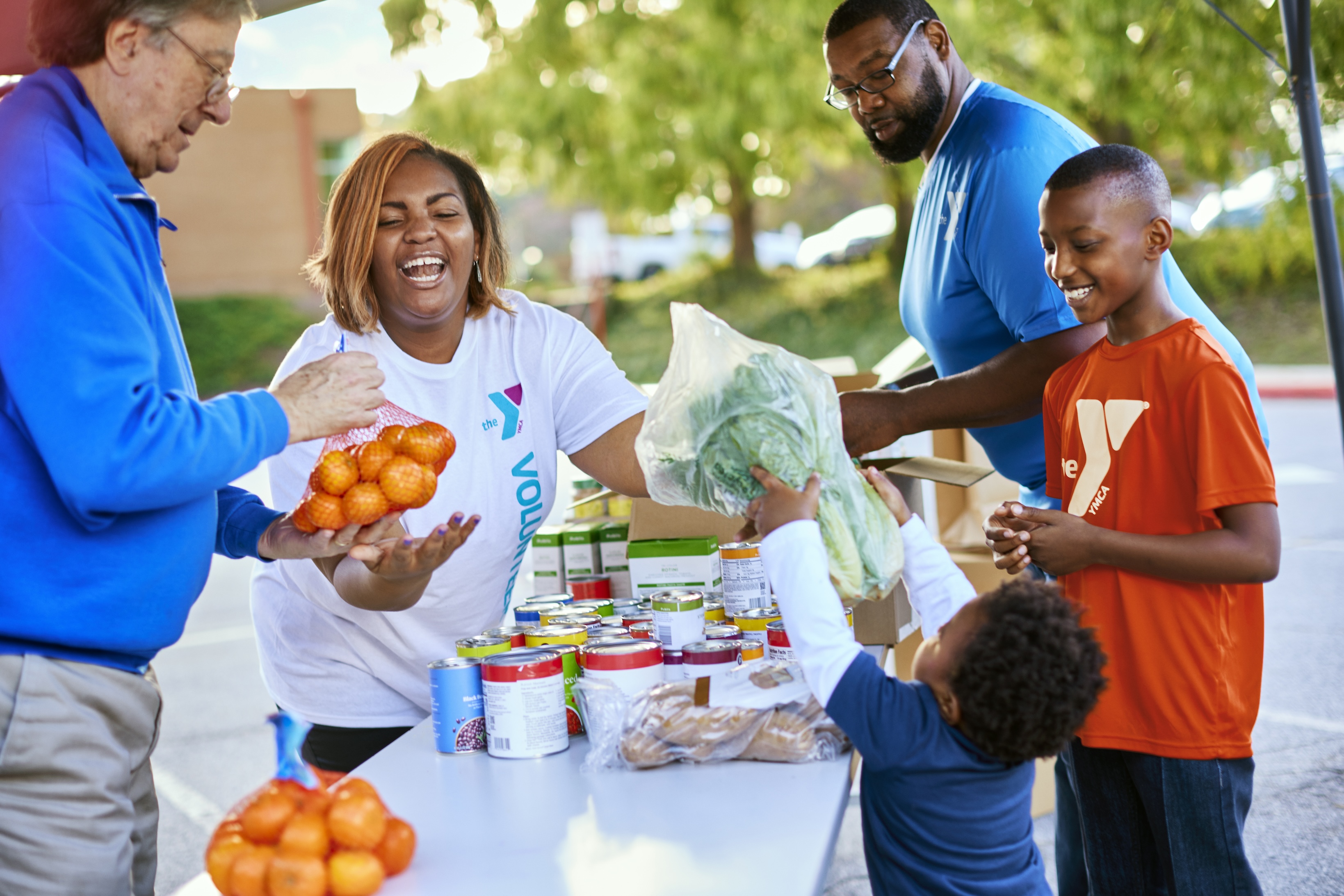 YMCA volunteers packing food boxes