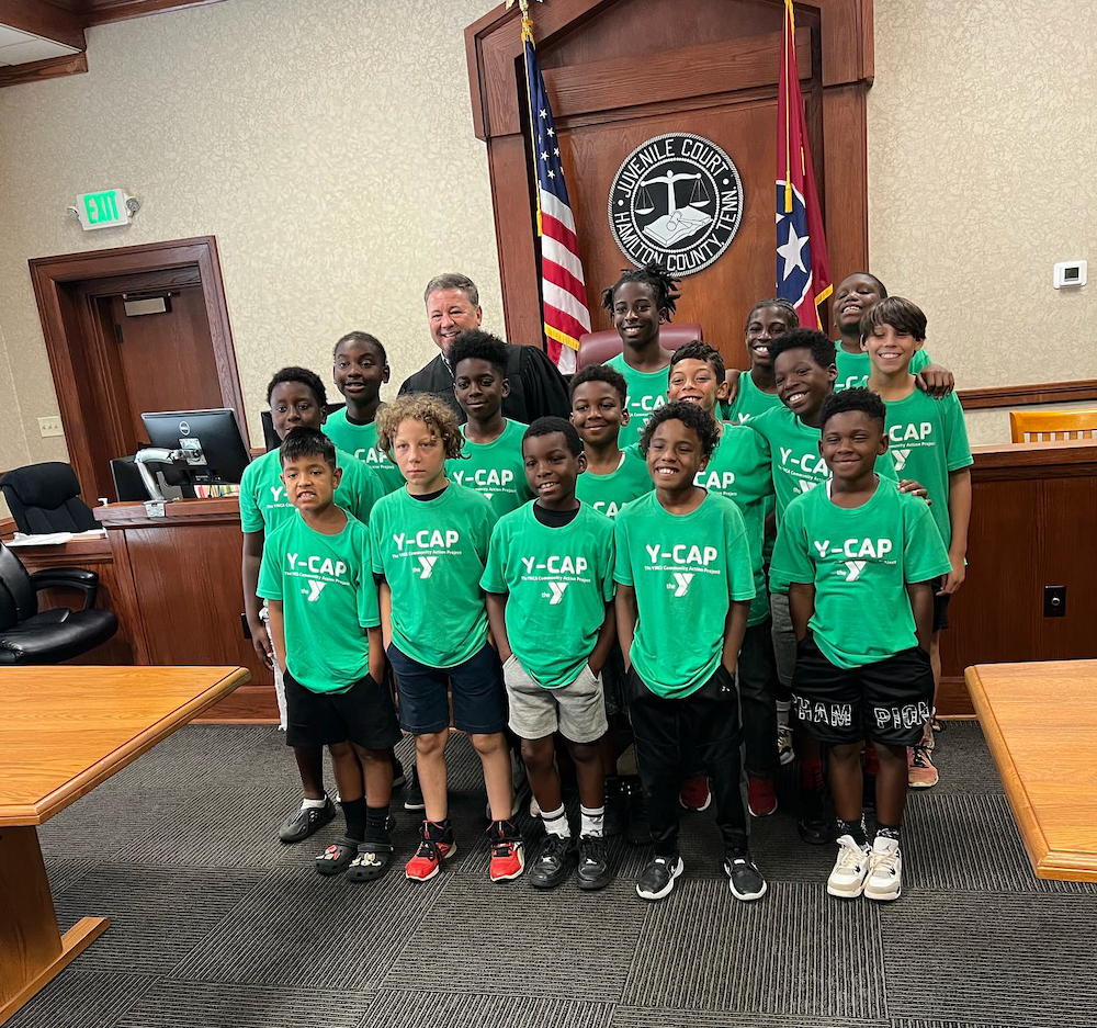 a group of Y-CAP kids posing for a picture in the juvenile court 