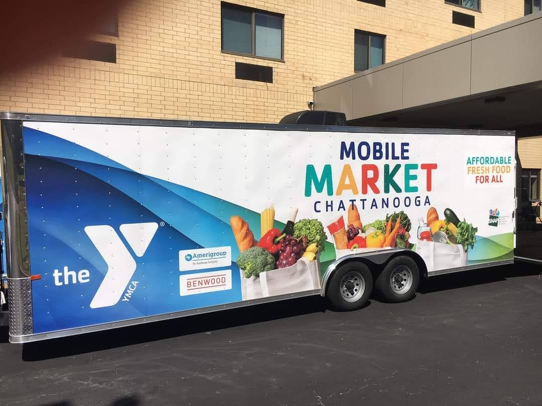 Mobile Market Truck parked outside of a buliding