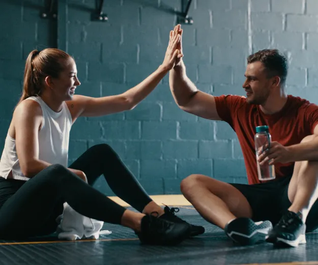 High fiving fitness class