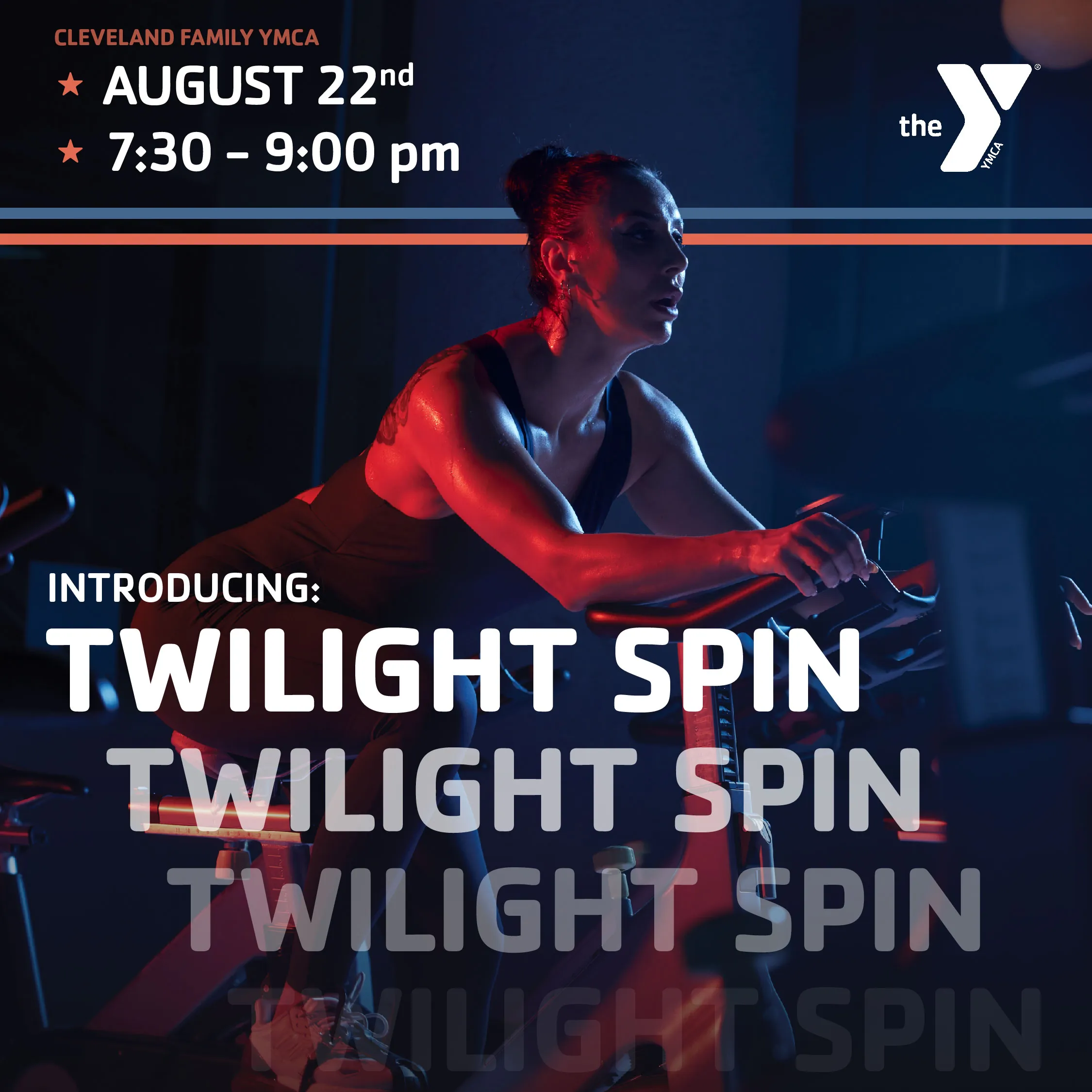 A woman working out on a spin bike exercise machine at night, red and blue lights reflect on her face & the spin bike.