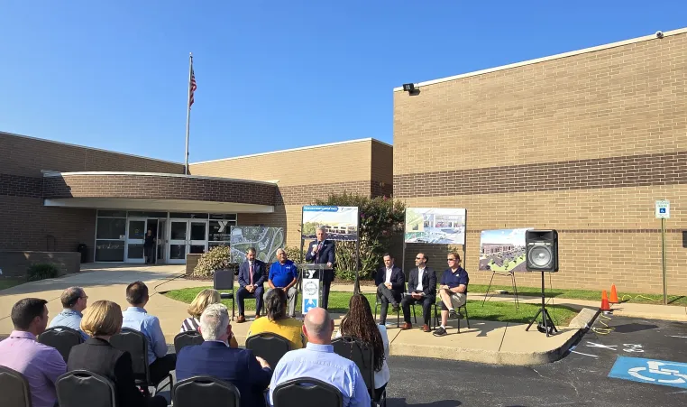 Baron speaks to group at press conference