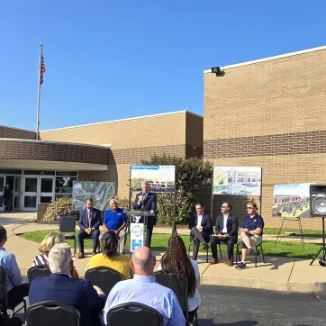 Baron speaks to group at press conference