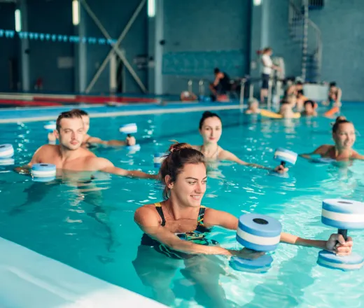 water fitness class with hand weights